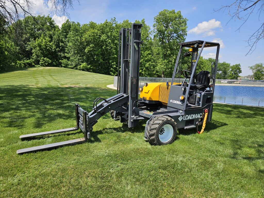 Loadmac truck mounted forklift pantograph "double reach" for one side loading and unloading.