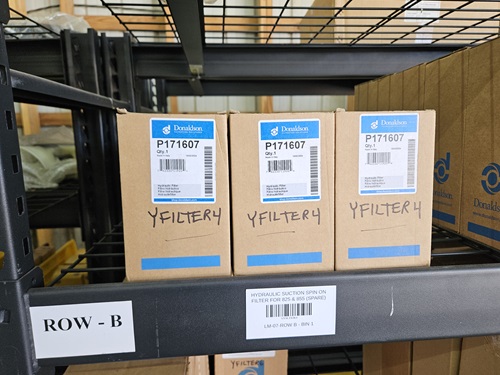 Boxes of Loadmac parts labeled P171607 and YFILTER4 on a storage shelf, highlighting essential components for maintaining truck-mounted forklifts.