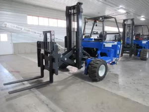 This is Princeton piggyback forklifts model PB55.3x. This is the only Prince model that can one side offload because is has fork carriage extending mechanism similar to the Moffett extra reach pantograph. Prince does not currently offer a 4-way piggyback forklift with this capability.