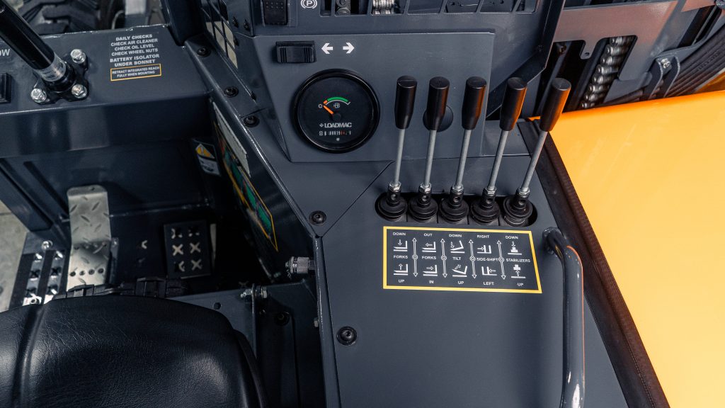 Close-up detail of the operator controls on the GoLoadMac 255 Ultra 2-Way truck mounted forklift. Located at 18915 Bull Rapids Rd, Spencerville, IN 46788.