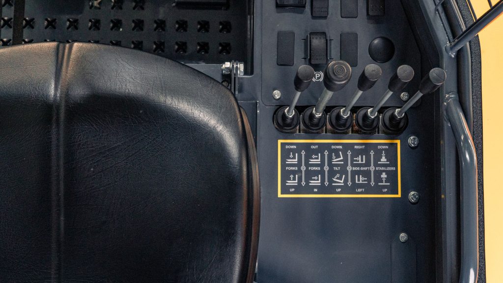 GoLoadMac 855 Super Reach 2-Way truck mounted forklift detail shot highlighting cab, controls, and safety features.
