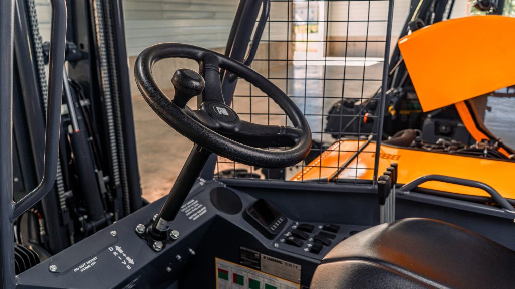 GoLoadMac 855 4-Way truck mounted forklift detail shot highlighting cab, controls, and safety features.
