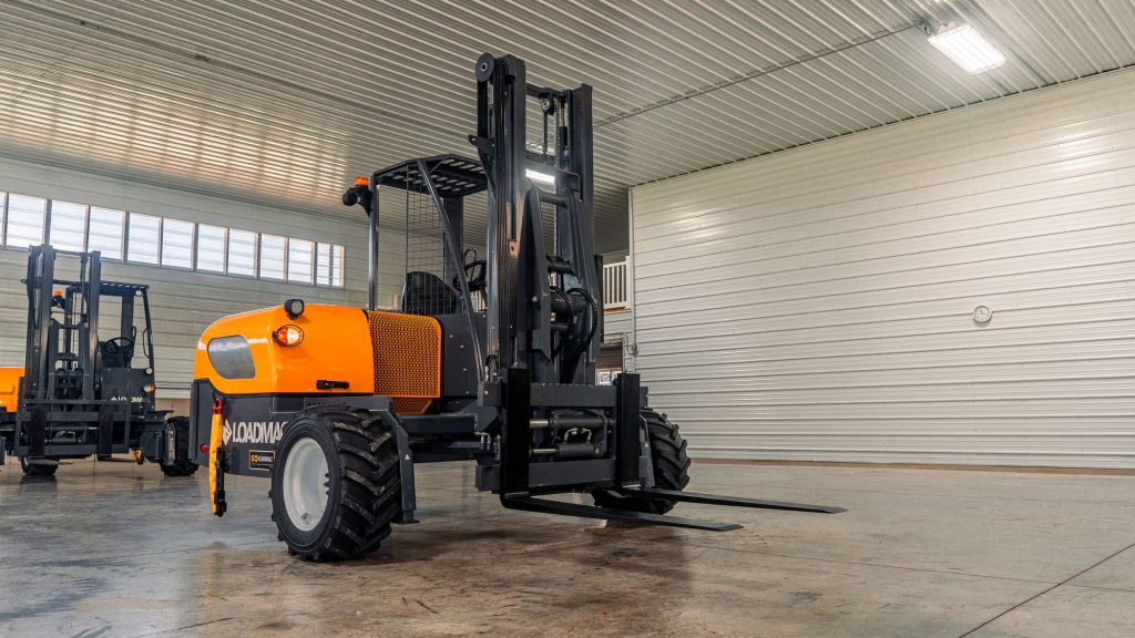GoLoadMac 855 4-Way truck mounted forklift detail shot highlighting cab, controls, and safety features.